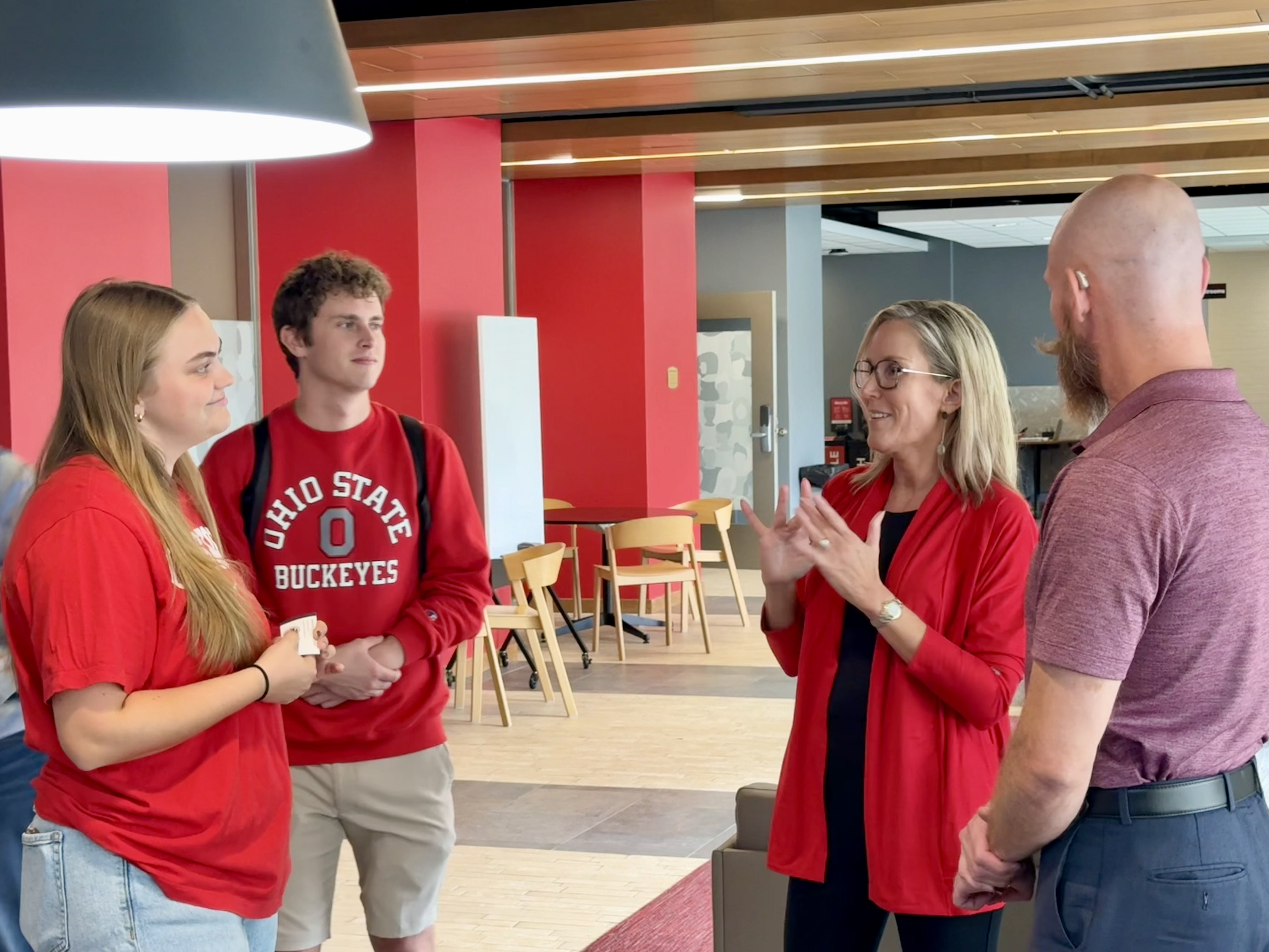 Director Kristin signing with students