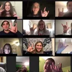 A group of people in a zoom meeting signing "I love you"